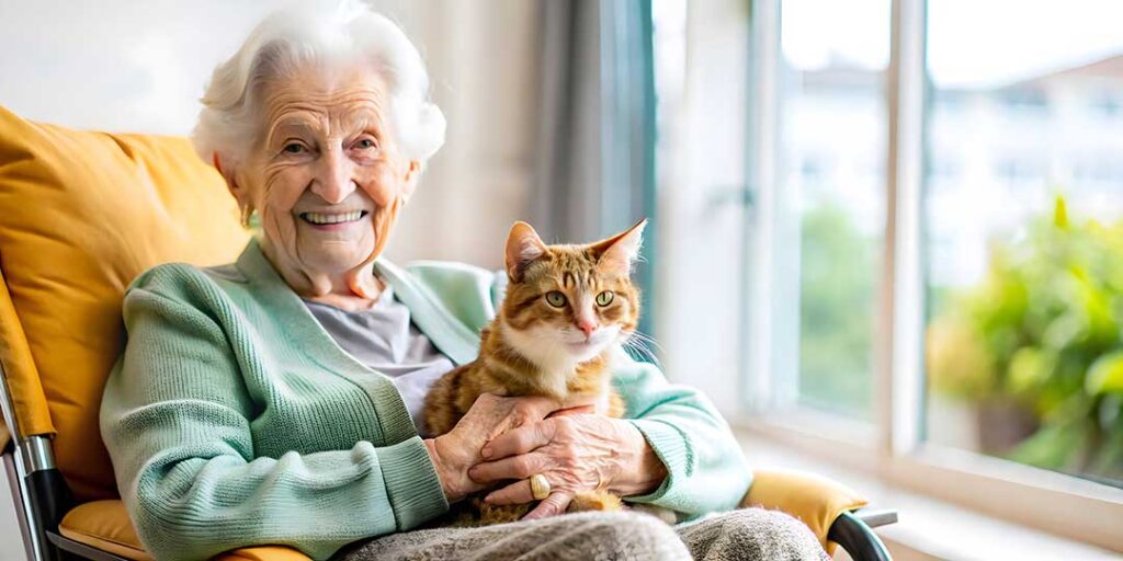 Older woman reviewing medications with an adult daughter at a kitchen table.
